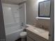 Bathroom with vanity, mirror, and shower-tub combination at 615 S Royal Crest Cir # 15, Las Vegas, NV 89169