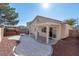 Inviting backyard featuring a covered patio, gravel landscaping, and a hot tub at 6314 Ruby Cedar Ct, North Las Vegas, NV 89031