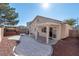 Beautiful backyard featuring a covered patio, gravel landscaping, and a relaxing hot tub at 6314 Ruby Cedar Ct, North Las Vegas, NV 89031