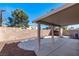 Backyard with a covered patio, gravel landscaping, and privacy wall at 6314 Ruby Cedar Ct, North Las Vegas, NV 89031
