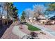 Scenic neighborhood walking path with mature trees and manicured landscaping at 6314 Ruby Cedar Ct, North Las Vegas, NV 89031
