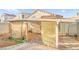 This backyard patio is covered and features plants and shade, creating a great outdoor space at 6653 Lund Dr, Las Vegas, NV 89108