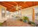 Covered patio featuring an outdoor ceiling fan with desert landscaping and block wall at 6653 Lund Dr, Las Vegas, NV 89108