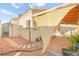 View of the backyard featuring desert landscaping, patio area, and partial shade structure at 6653 Lund Dr, Las Vegas, NV 89108