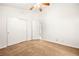 Neutral bedroom with a ceiling fan, closet, and natural light at 6653 Lund Dr, Las Vegas, NV 89108