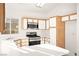 Well-lit kitchen with stainless steel appliances and white countertops at 6653 Lund Dr, Las Vegas, NV 89108