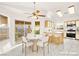 Bright kitchen with tile floors, ceiling fan, breakfast bar, and stainless steel appliances at 6653 Lund Dr, Las Vegas, NV 89108