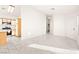 Inviting living room with a partial view of the kitchen and tile flooring at 6653 Lund Dr, Las Vegas, NV 89108