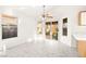 Open living room with tile flooring, a ceiling fan, and bright windows at 6653 Lund Dr, Las Vegas, NV 89108