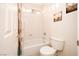 This bathroom features a tub/shower combo with white tile and decorative accents at 692 Quilt Pl, Henderson, NV 89052