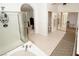 Bright bathroom featuring dual sinks, separate shower and walk-in closet at 692 Quilt Pl, Henderson, NV 89052