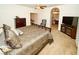 Tranquil main bedroom with neutral tones, furniture, and a decorative bedspread at 692 Quilt Pl, Henderson, NV 89052