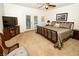 Bright main bedroom with plush carpet, walk out patio, and a ceiling fan at 692 Quilt Pl, Henderson, NV 89052