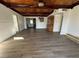 Spacious living room featuring hardwood floors and a wood beam ceiling at 712 Harvard St, Las Vegas, NV 89107