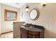 Quaint powder room with granite countertop and a stylish sink, perfect for guests and conveniently located in the home at 7229 Mira Vista St, Las Vegas, NV 89120