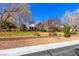 Charming single-story home with brick accents, mature trees, and a well-manicured lawn on a sunny day at 7229 Mira Vista St, Las Vegas, NV 89120