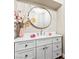 Charming powder room featuring stylish vanity with round mirror and decorative accents at 7229 Mira Vista St, Las Vegas, NV 89120