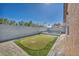 Well-kept backyard putting green is surrounded by brick pavers, and a privacy wall at 7308 Alpine Ridge St, Las Vegas, NV 89131