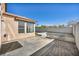 Backyard featuring privacy wall, in-ground firepit with built-in benches, and two large windows at 7308 Alpine Ridge St, Las Vegas, NV 89131