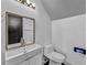 Modern bathroom with a sleek vanity, mirror, and fixtures at 7308 Alpine Ridge St, Las Vegas, NV 89131