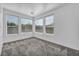 Inviting bedroom with large windows and neutral carpet flooring at 7308 Alpine Ridge St, Las Vegas, NV 89131