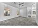 Spacious bedroom with plush carpet, neutral walls, and natural light from multiple windows at 7308 Alpine Ridge St, Las Vegas, NV 89131