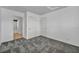 Carpeted bedroom featuring two doors, and a view into an en suite bathroom at 7308 Alpine Ridge St, Las Vegas, NV 89131