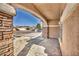 Covered front porch featuring stone columns and desert landscaping at 7308 Alpine Ridge St, Las Vegas, NV 89131