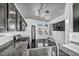 Bright kitchen with granite countertops, stainless steel sink, and views through the window at 7308 Alpine Ridge St, Las Vegas, NV 89131