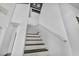 Bright staircase with modern black treads, white risers, and clean white textured walls at 7308 Alpine Ridge St, Las Vegas, NV 89131