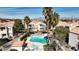 Inviting community pool area framed by palm trees, offering a relaxing retreat for residents at 8301 Boseck Dr # 215, Las Vegas, NV 89145