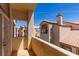 Balcony view of exterior with tiled roof and stucco facade on a sunny day at 8301 Boseck Dr # 215, Las Vegas, NV 89145