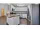 Kitchen area featuring white cabinets, stainless steel appliances, granite counters, and an open layout at 8301 Boseck Dr # 215, Las Vegas, NV 89145