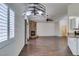 Open living area with kitchen, fireplace and wood flooring at 8301 Boseck Dr # 215, Las Vegas, NV 89145