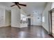 Open floor plan with wood floors and view of kitchen area with stainless fridge at 8301 Boseck Dr # 215, Las Vegas, NV 89145
