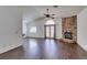 Bright living room boasting elegant floors, a stone fireplace, high ceilings, and double door access at 8301 Boseck Dr # 215, Las Vegas, NV 89145