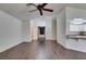 Open living space with wood floors, contemporary lighting and open access to kitchen at 8301 Boseck Dr # 215, Las Vegas, NV 89145