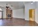 Spacious living room featuring stylish floors, a stone fireplace, and access to the outdoors at 8301 Boseck Dr # 215, Las Vegas, NV 89145