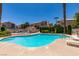 Community pool surrounded by lush landscaping, perfect for relaxation and recreation at 8301 Boseck Dr # 215, Las Vegas, NV 89145