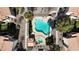 Birds-eye view of a community pool and hot tub with lounge chairs, landscaping and nearby residences at 8301 Boseck Dr # 215, Las Vegas, NV 89145