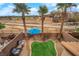 Enjoy outdoor living with a custom patio, palm trees, and artificial turf area at 8349 Spruce Bay Ave, Las Vegas, NV 89178