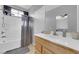 Bathroom featuring modern fixtures, a shower with a gray curtain, and light wood cabinets at 8349 Spruce Bay Ave, Las Vegas, NV 89178