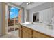 Bathroom featuring a bright sliding glass door that provides backyard view and natural light at 8349 Spruce Bay Ave, Las Vegas, NV 89178