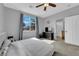 Bedroom featuring a window with palm tree view, and neutral color walls at 8349 Spruce Bay Ave, Las Vegas, NV 89178