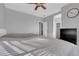 Bedroom featuring carpet, ceiling fan, and a gray color scheme at 8349 Spruce Bay Ave, Las Vegas, NV 89178