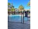 Sparkling community pool surrounded by well-maintained fences with pool guest regulations visible at 9050 W Warm Springs Rd # 2016, Las Vegas, NV 89148