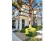 The building's exterior features well-maintained landscaping and charming architectural details at 9050 W Warm Springs Rd # 2016, Las Vegas, NV 89148