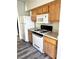 Kitchen featuring a white refrigerator, white gas stove, and a microwave oven at 9050 W Warm Springs Rd # 2016, Las Vegas, NV 89148