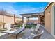 Backyard area with a fire pit and covered patio, ideal for outdoor gathering and relaxation at 920 Claystone Ridge Ave, North Las Vegas, NV 89084