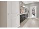 Bathroom featuring a double sink vanity and access to the backyard at 920 Claystone Ridge Ave, North Las Vegas, NV 89084